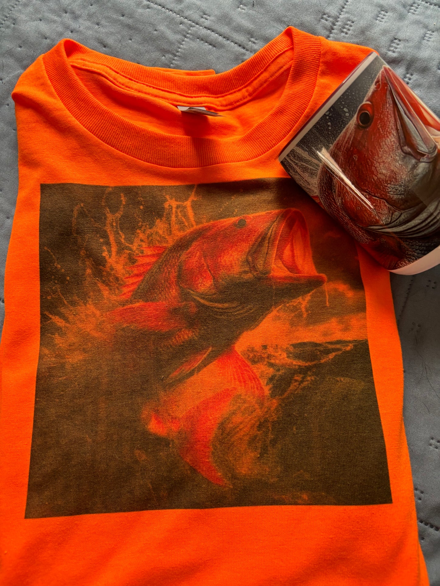 A fishing T-shirt with a matching coffee cup